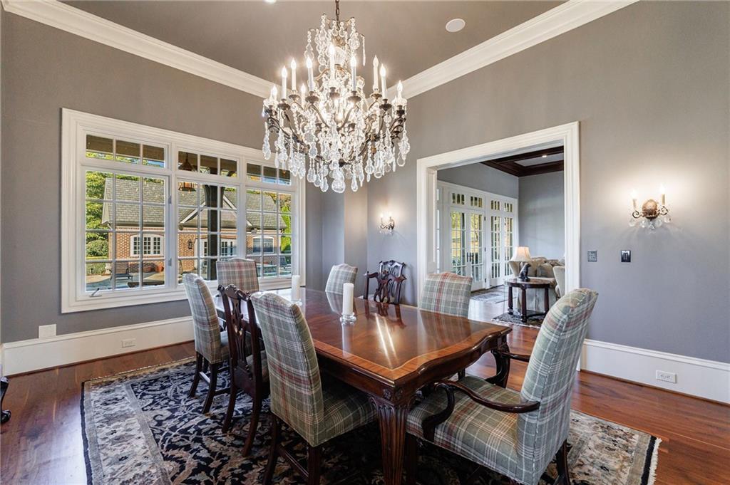 15750 Freemanville Road Milton, GA 30004 - Photo 13 of 30 a view of a dining room with furniture and chandelier