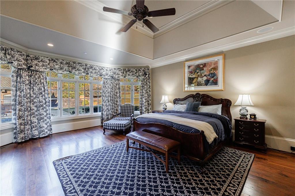 15750 Freemanville Road Milton, GA 30004 - Photo 22 of 30 a bed room with a bed and a couch