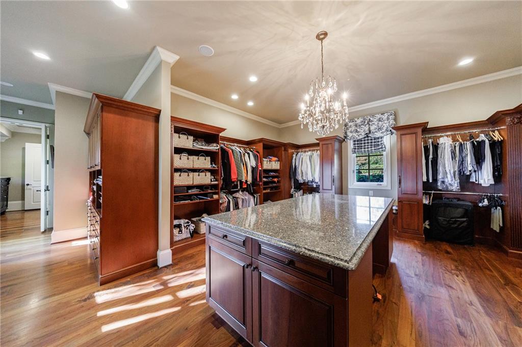 15750 Freemanville Road Milton, GA 30004 - Photo 27 of 30 a kitchen with stainless steel appliances granite countertop a refrigerator a stove and a wooden floors