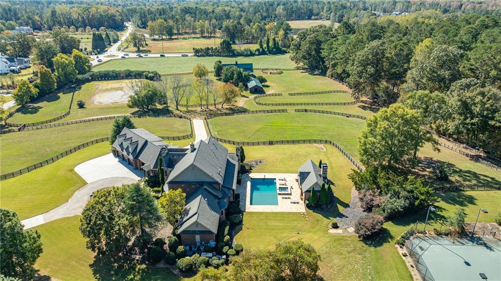 15750 Freemanville Road Milton, GA 30004 - Photo 3 of 30 an aerial view of a house with outdoor space pool seating area and yard