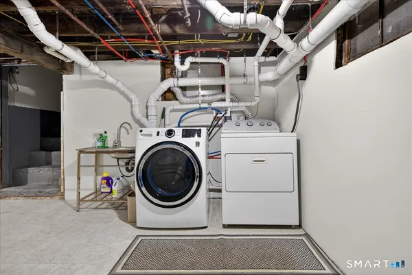 a utility room with dryer and washer
