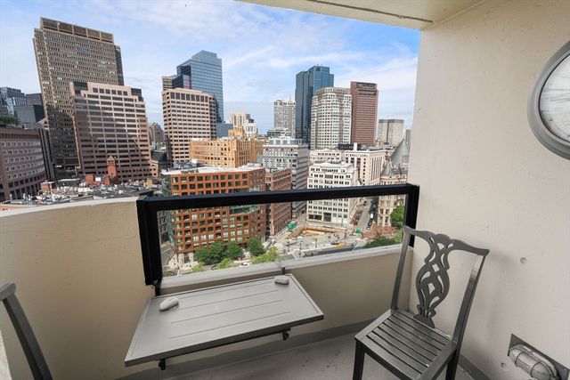 a view of a balcony with chairs