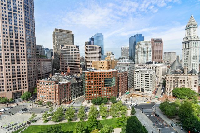 a view of a city with tall buildings