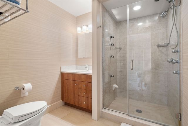 a bedroom with furniture and wooden floor