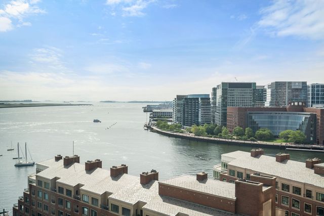 a view of a lake with tall buildings