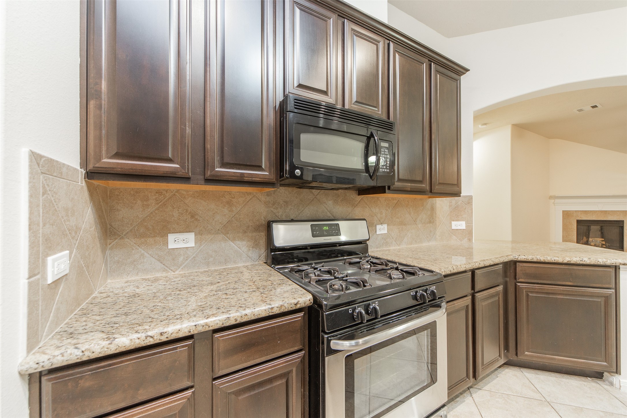 3418 Lily Ranch Drive Katy, TX 77494 - Photo 12 of 24 a kitchen with granite countertop stainless steel appliances and cabinets