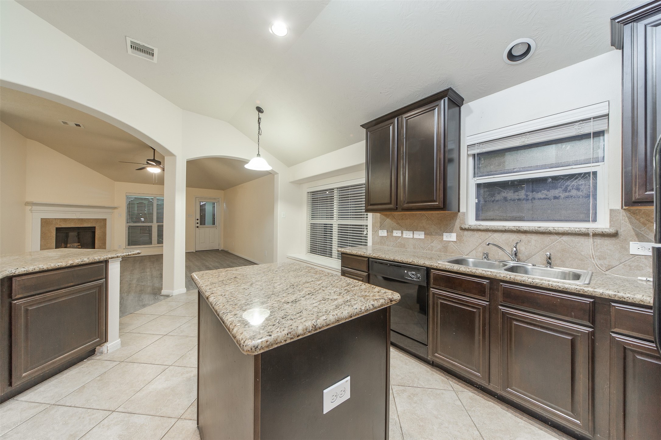 3418 Lily Ranch Drive Katy, TX 77494 - Photo 13 of 24 a kitchen with a sink stove and refrigerator