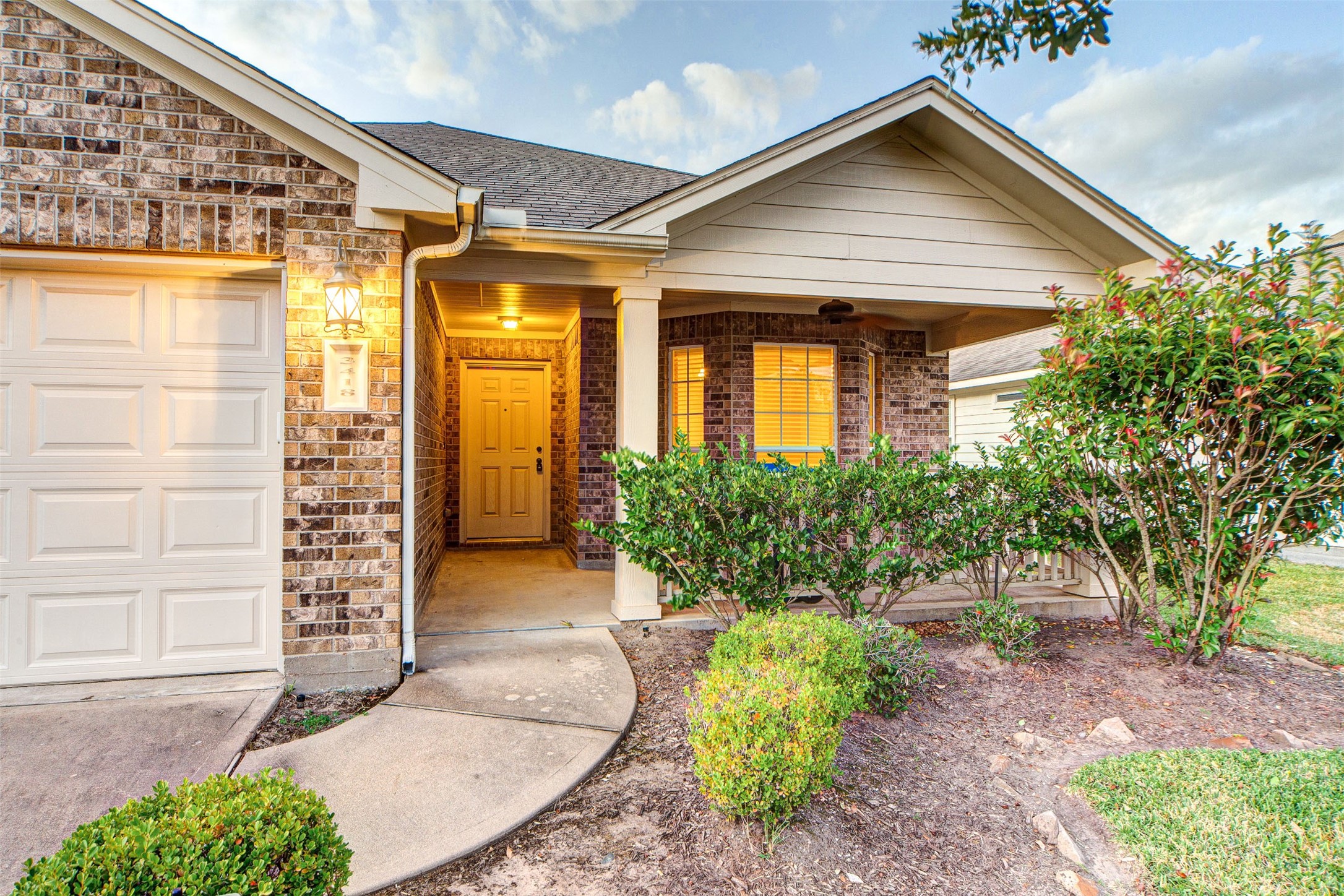 3418 Lily Ranch Drive Katy, TX 77494 - Photo 3 of 24 a front view of a house with garden
