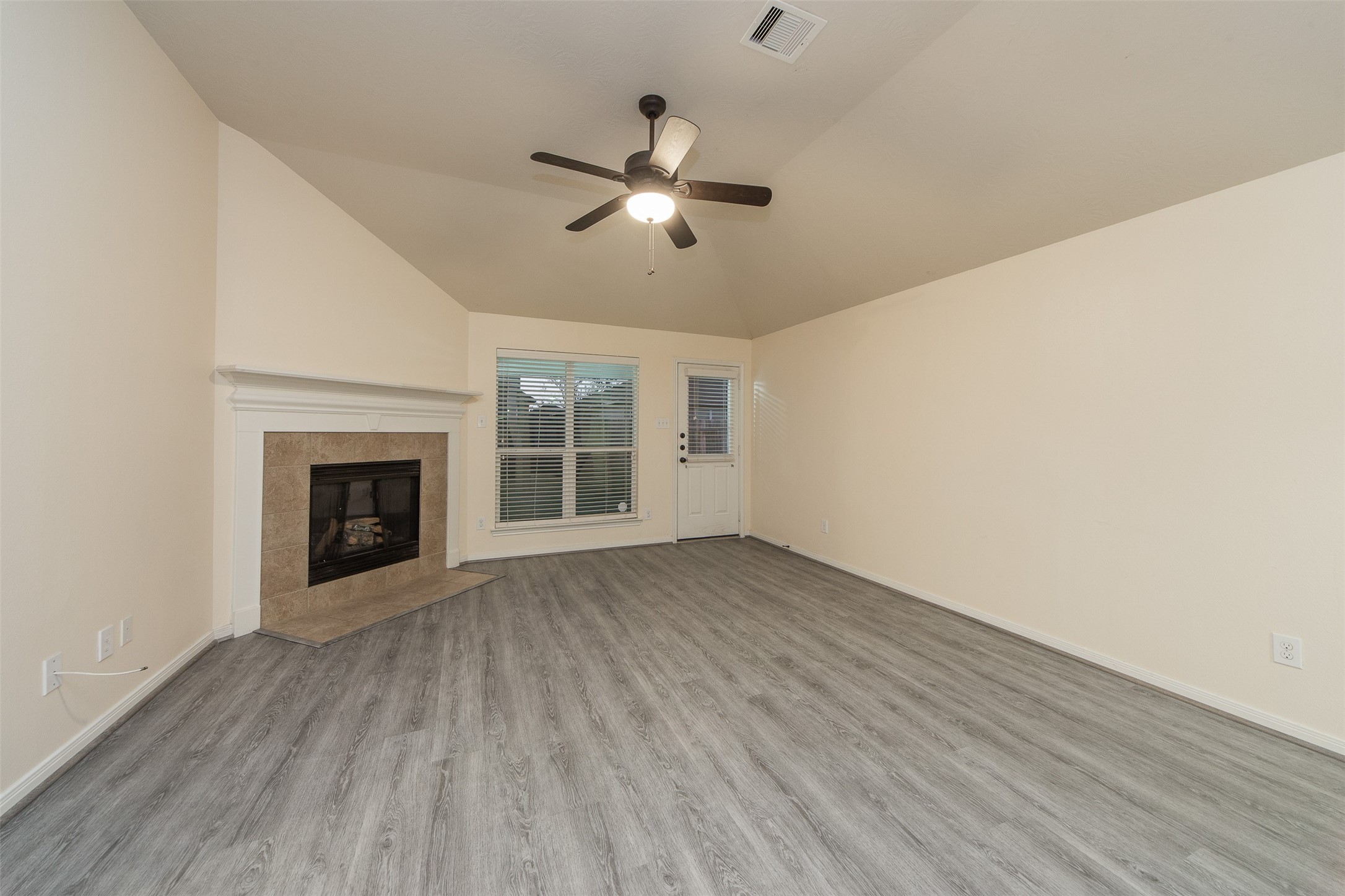 3418 Lily Ranch Drive Katy, TX 77494 - Photo 7 of 24 wooden floor in an empty room with a fireplace