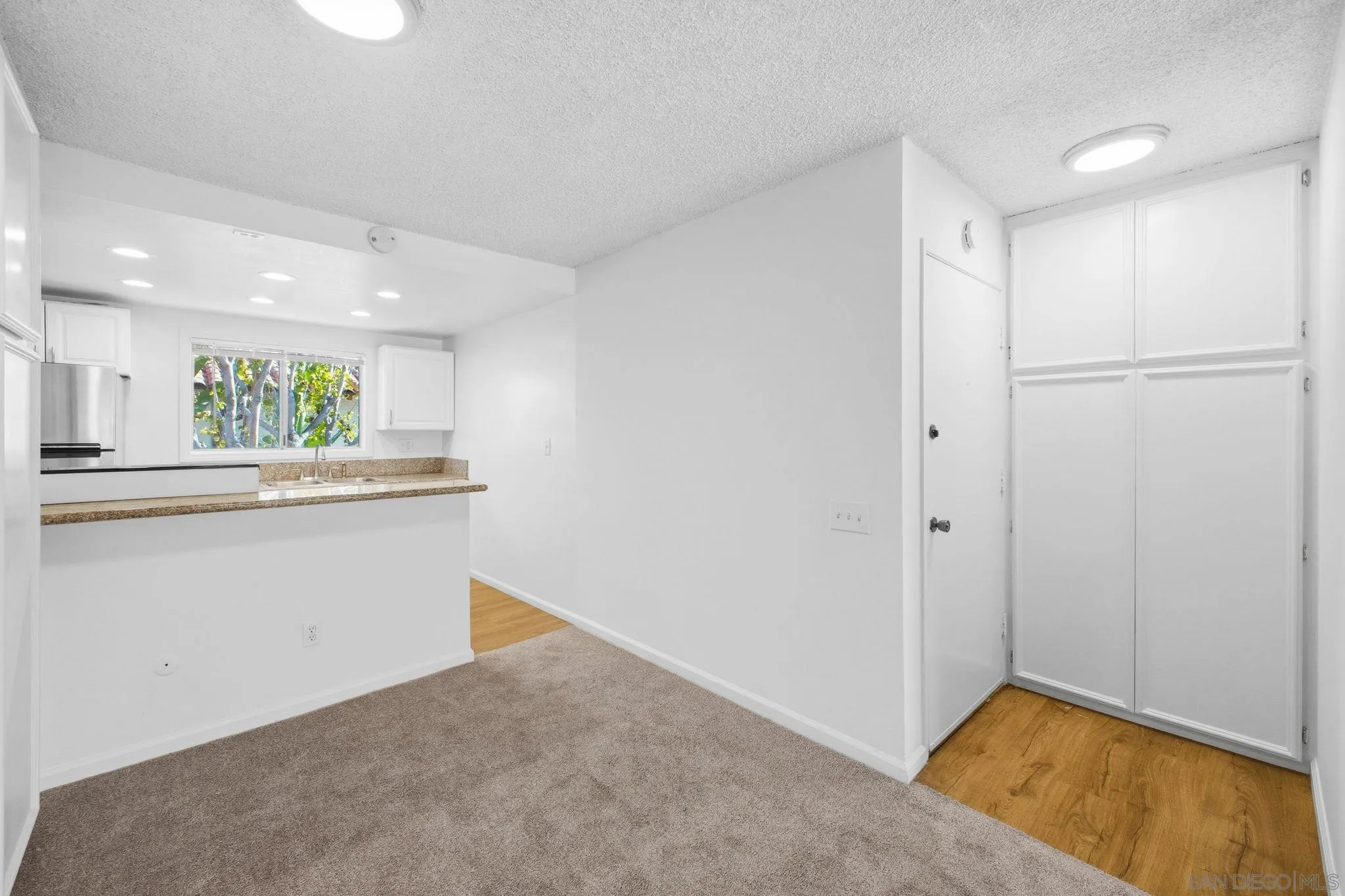 6019 Rancho Mission Road, Unit 204 San Diego, CA 92108 - Photo 14 of 38 Open concept living - kitchen to living room