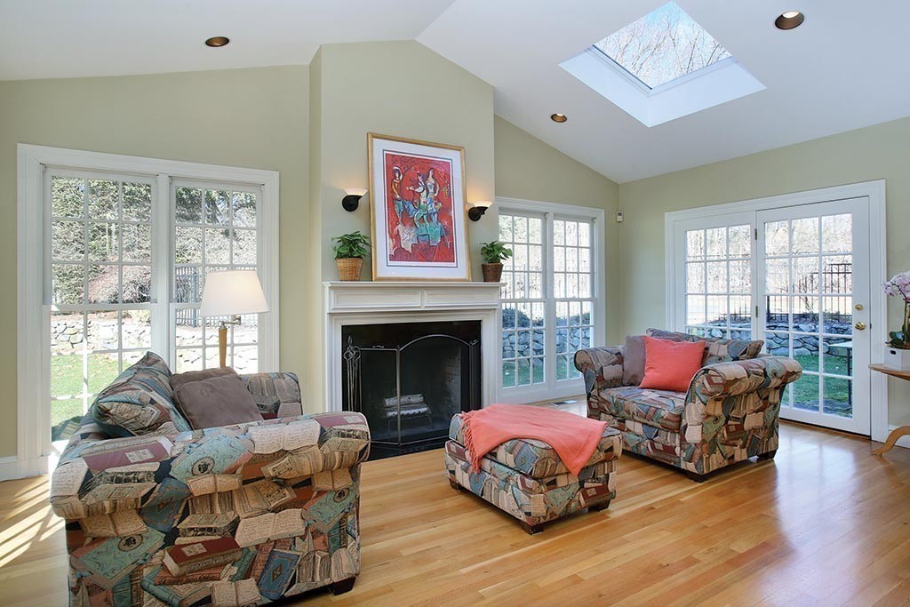 24 Estabrook Road Newton, MA 02465 - Photo 11 of 15 a living room with furniture and a fireplace