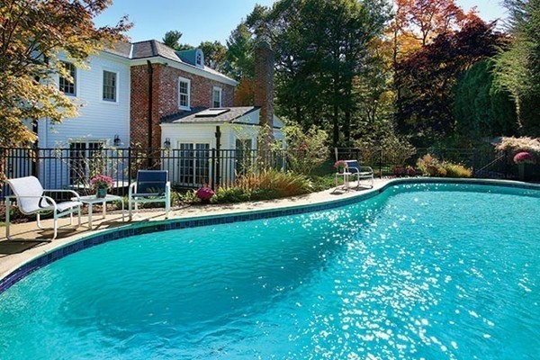 24 Estabrook Road Newton, MA 02465 - Photo 3 of 15 a view of a house with a yard and sitting area