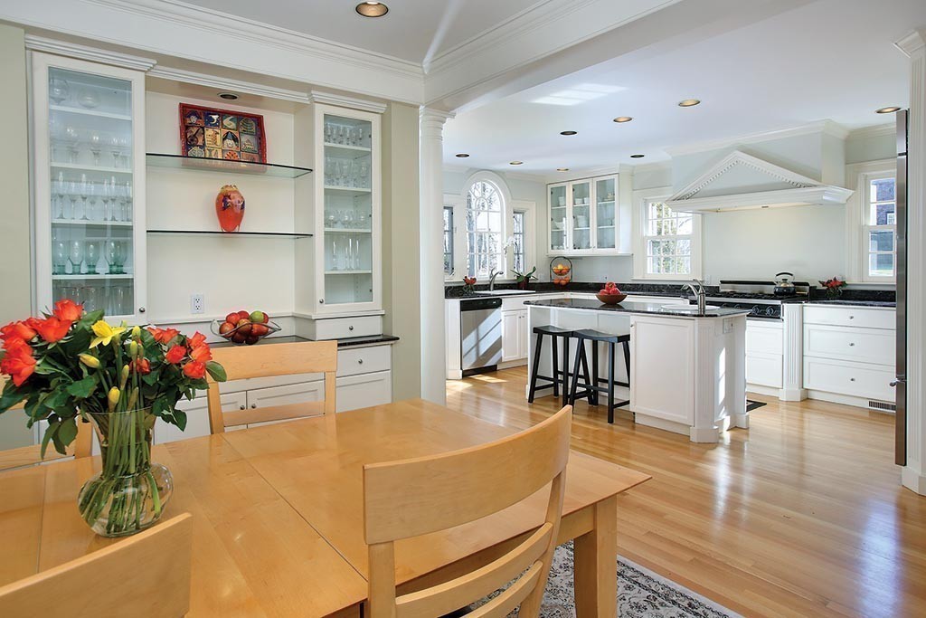 24 Estabrook Road Newton, MA 02465 - Photo 5 of 15 a kitchen with stainless steel appliances kitchen island granite countertop a stove and cabinets