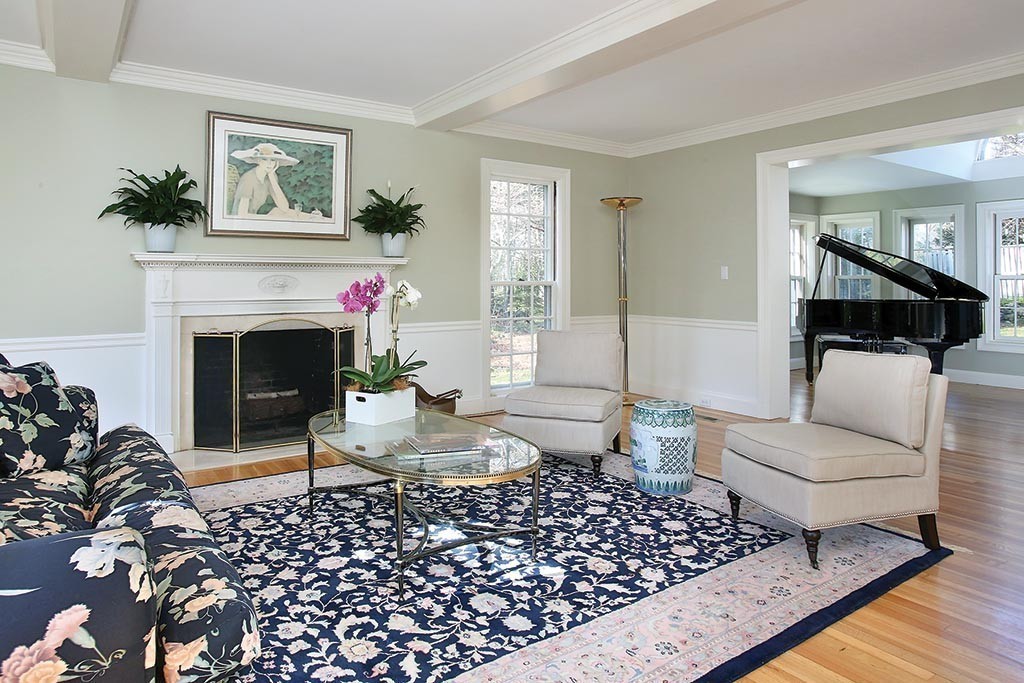 24 Estabrook Road Newton, MA 02465 - Photo 9 of 15 a living room with furniture a rug and a fireplace