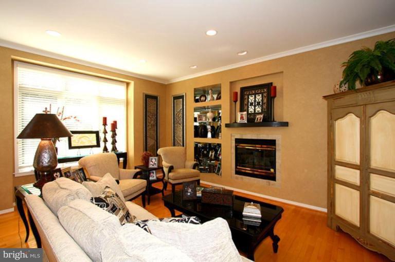 1441 Waterfront Road Reston, VA 20194 - Photo 15 of 30 a living room with furniture fireplace and a flat screen tv
