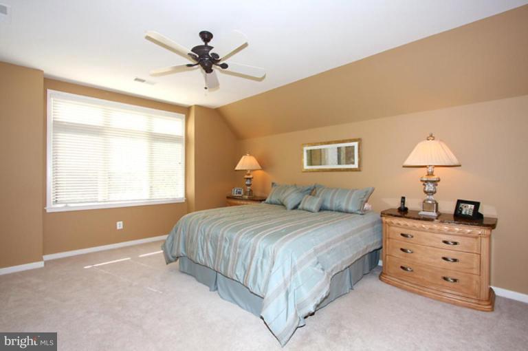 1441 Waterfront Road Reston, VA 20194 - Photo 16 of 30 a bedroom with a bed and a window