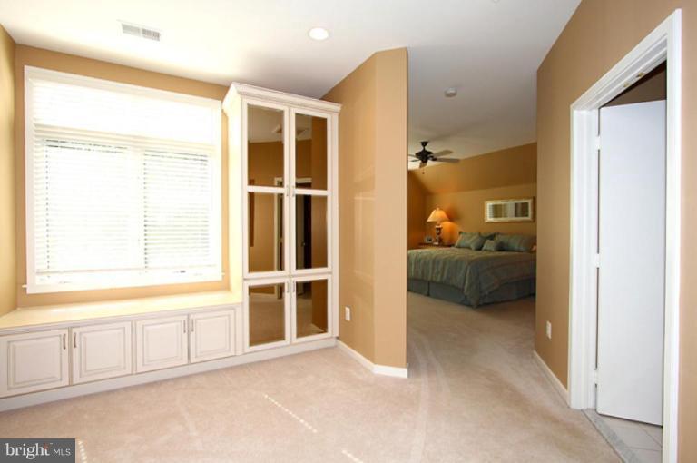 1441 Waterfront Road Reston, VA 20194 - Photo 17 of 30 a view of a bedroom with a bed and a window