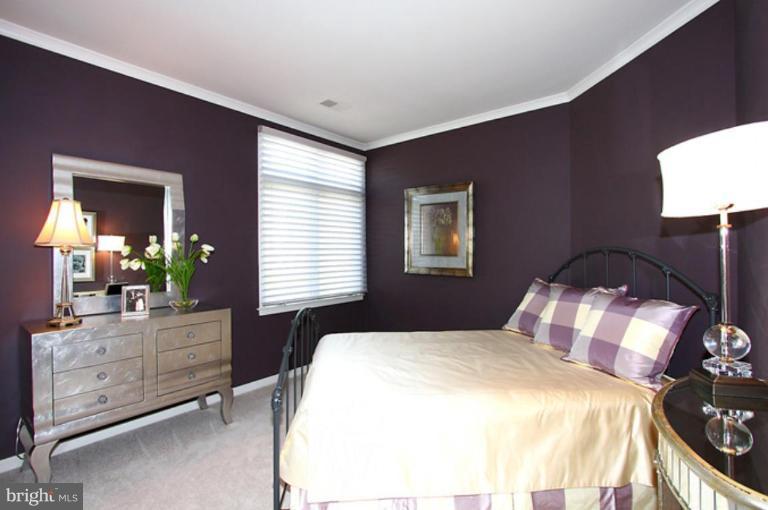 1441 Waterfront Road Reston, VA 20194 - Photo 19 of 30 a bedroom with a bed and a dresser