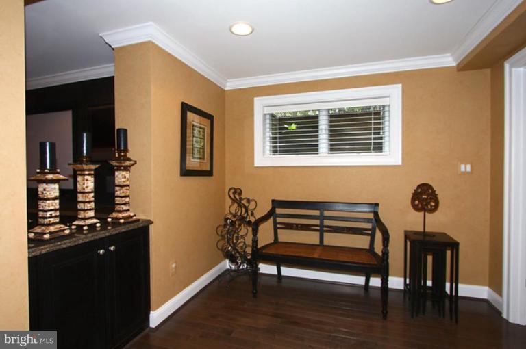 1441 Waterfront Road Reston, VA 20194 - Photo 23 of 30 a room with furniture and wooden floor