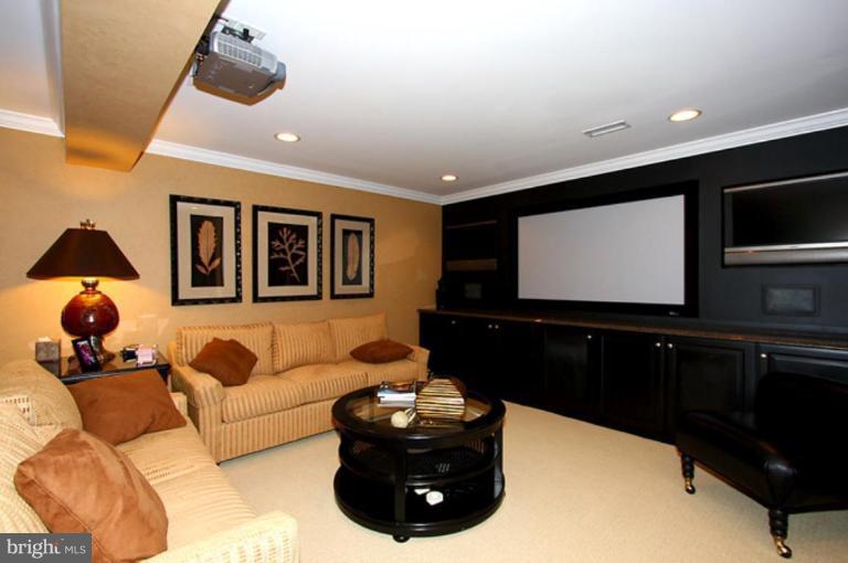 1441 Waterfront Road Reston, VA 20194 - Photo 25 of 30 a living room with furniture and a flat screen tv