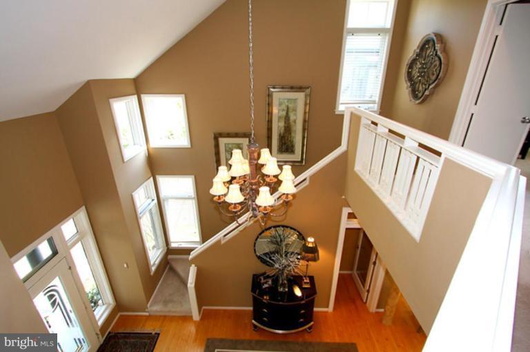 1441 Waterfront Road Reston, VA 20194 - Photo 7 of 30 a view of a living room with furniture and a chandelier