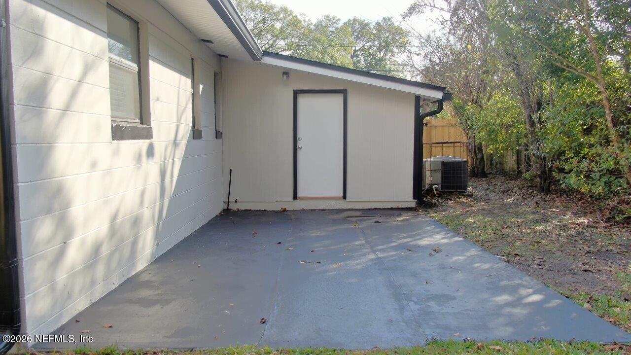 6713 Peter Rabbit Drive North Jacksonville, FL 32210 - Photo 19 of 24 a view of a house with a yard