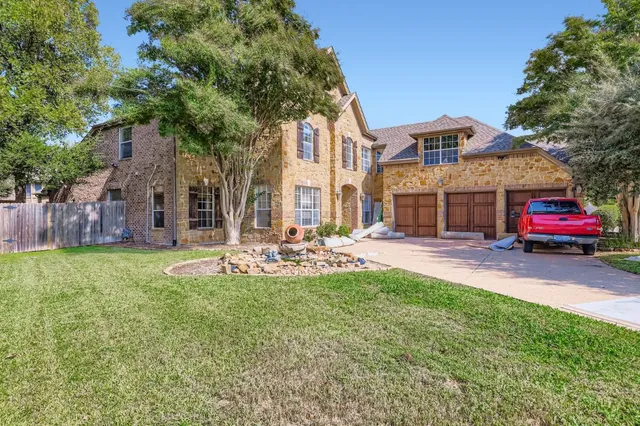 a view of a house with backyard porch and sitting area