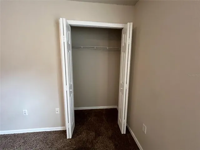 a view of a room with wooden door