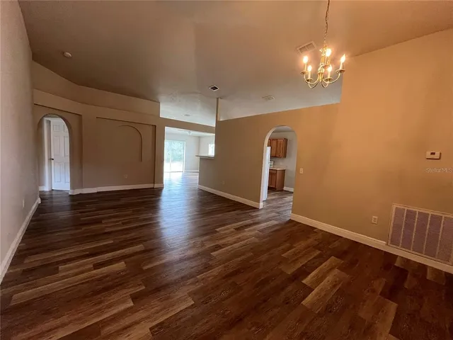 a view of a livingroom with wooden floor