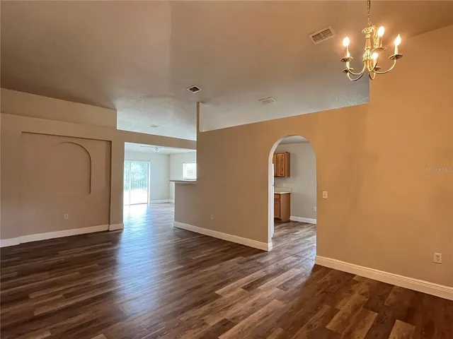 a view of a livingroom with wooden floor