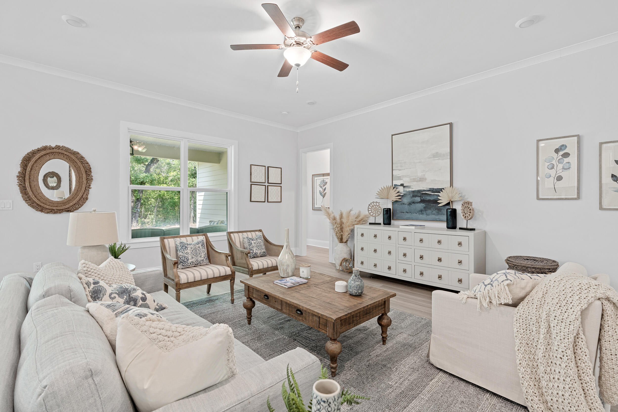 20 Mackenzie Lane, Unit LOT 34 Freeport, FL 32439 - Photo 12 of 50 a living room with furniture and a window