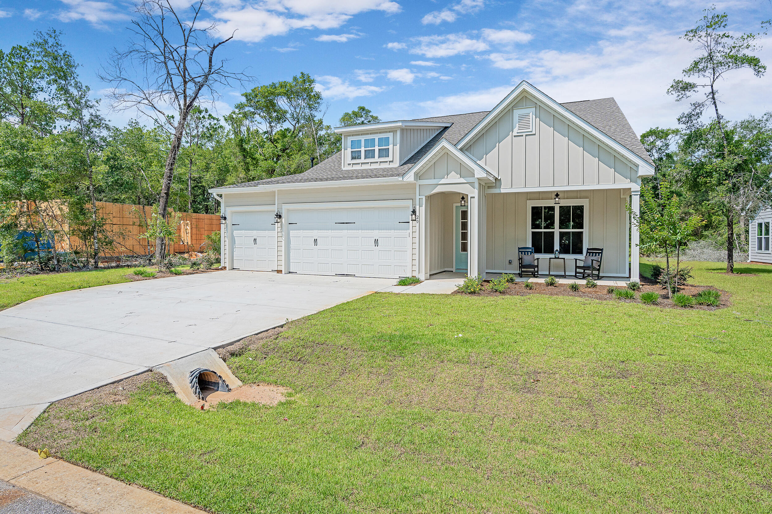 20 Mackenzie Lane, Unit LOT 34 Freeport, FL 32439 - Photo 2 of 50 a front view of house with yard and green space