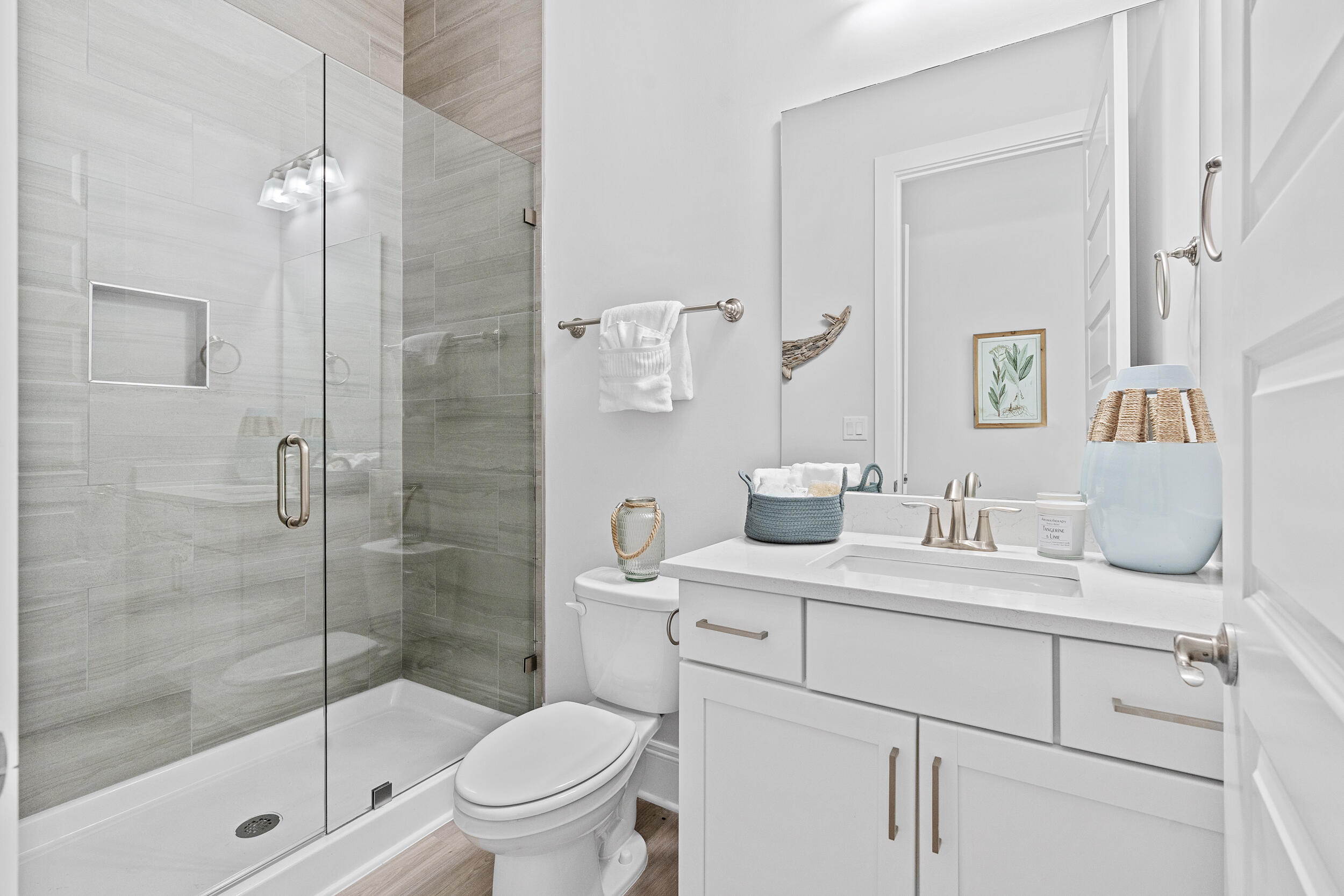 20 Mackenzie Lane, Unit LOT 34 Freeport, FL 32439 - Photo 32 of 50 a bathroom with a sink toilet vanity and shower