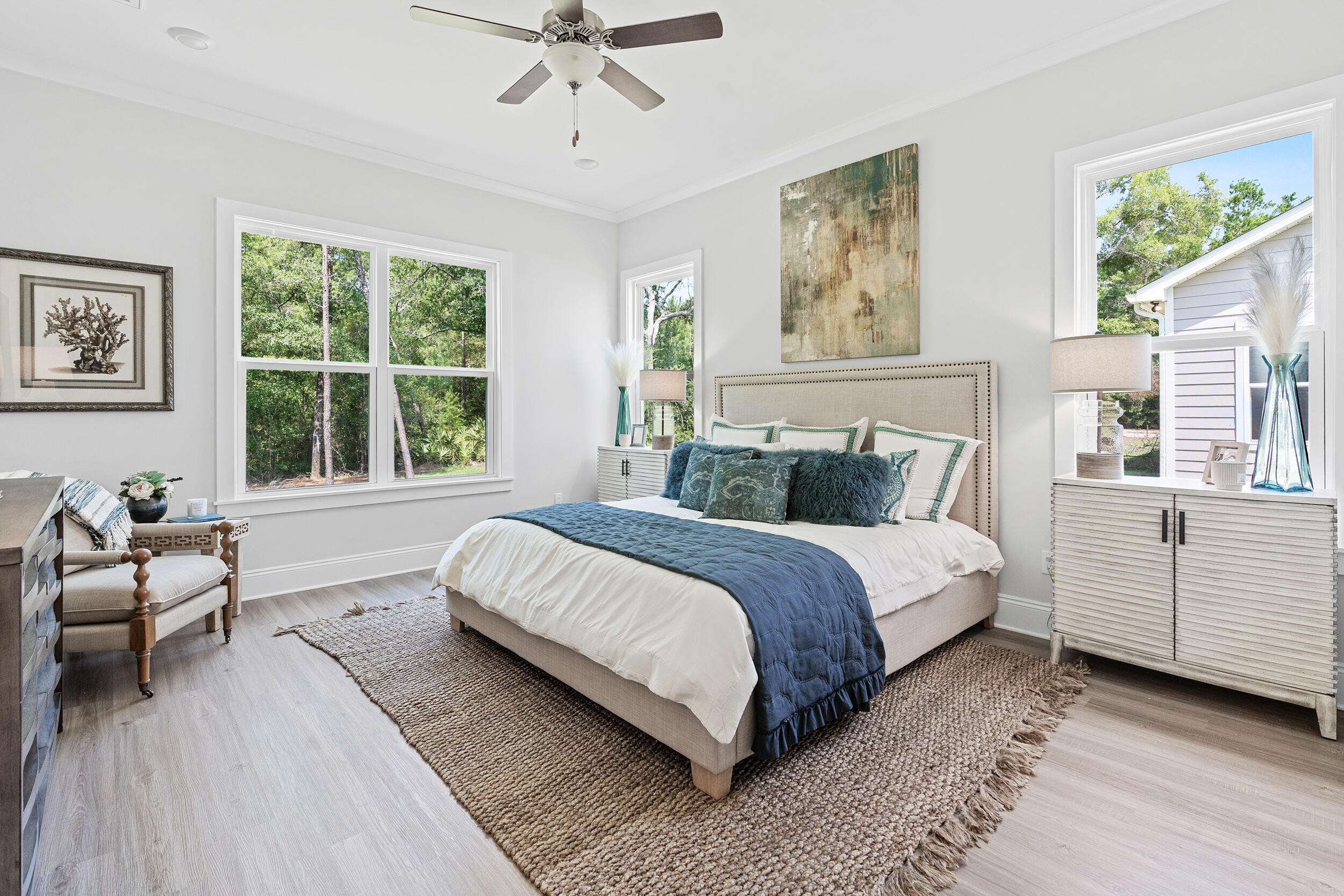 20 Mackenzie Lane, Unit LOT 34 Freeport, FL 32439 - Photo 33 of 50 a bedroom with a large bed and windows