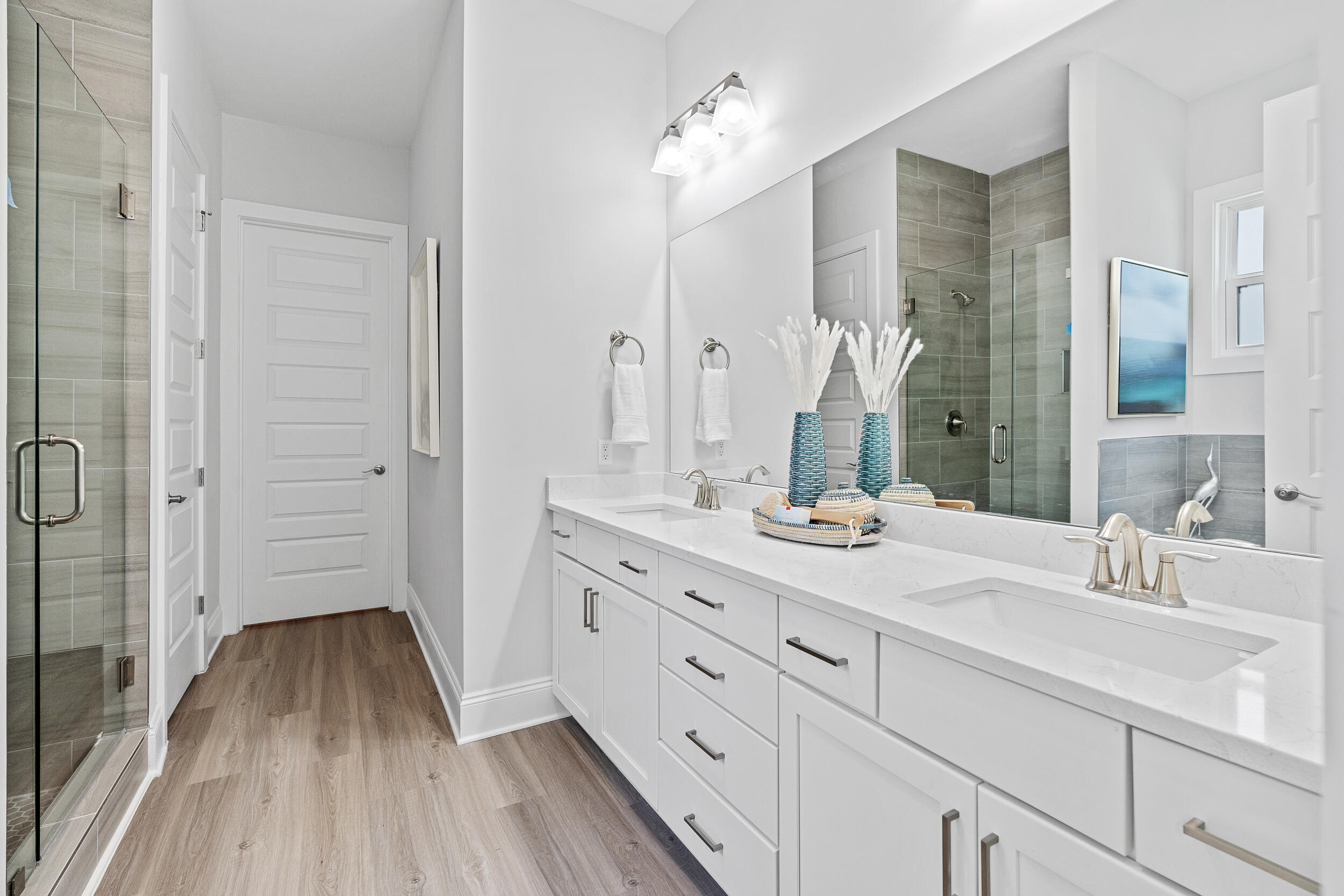 20 Mackenzie Lane, Unit LOT 34 Freeport, FL 32439 - Photo 35 of 50 a bathroom with a double vanity sink and mirror