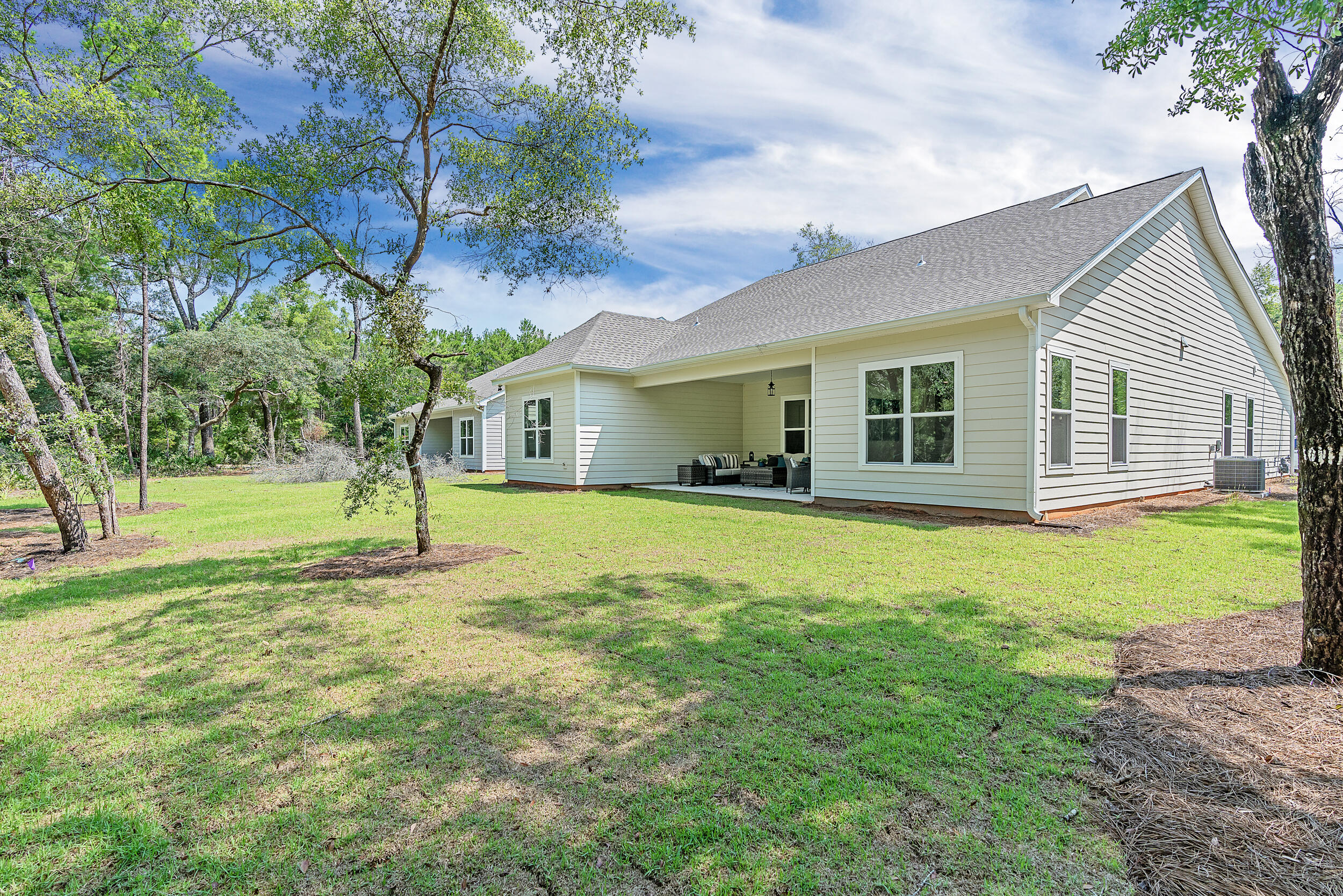 20 Mackenzie Lane, Unit LOT 34 Freeport, FL 32439 - Photo 43 of 50 a house view with a garden space