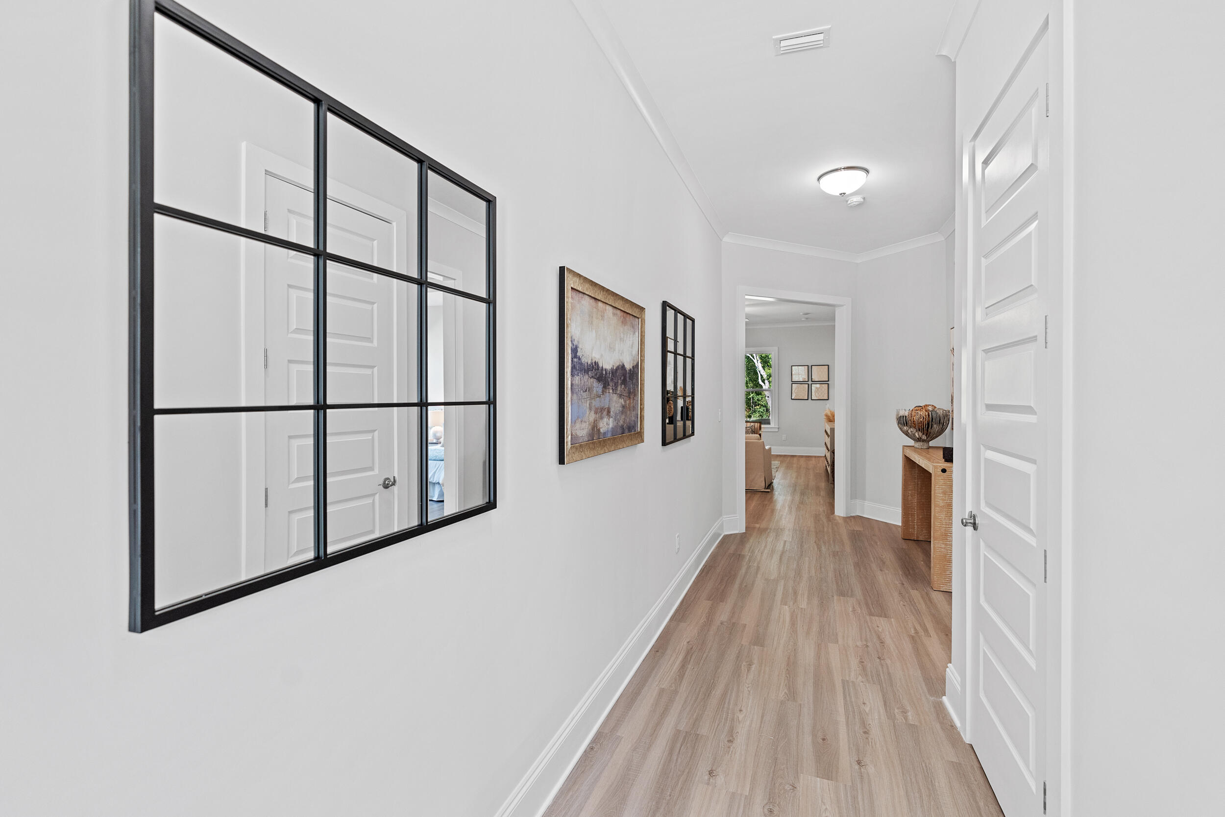 20 Mackenzie Lane, Unit LOT 34 Freeport, FL 32439 - Photo 6 of 50 a view of a hallway with wooden floor and staircase
