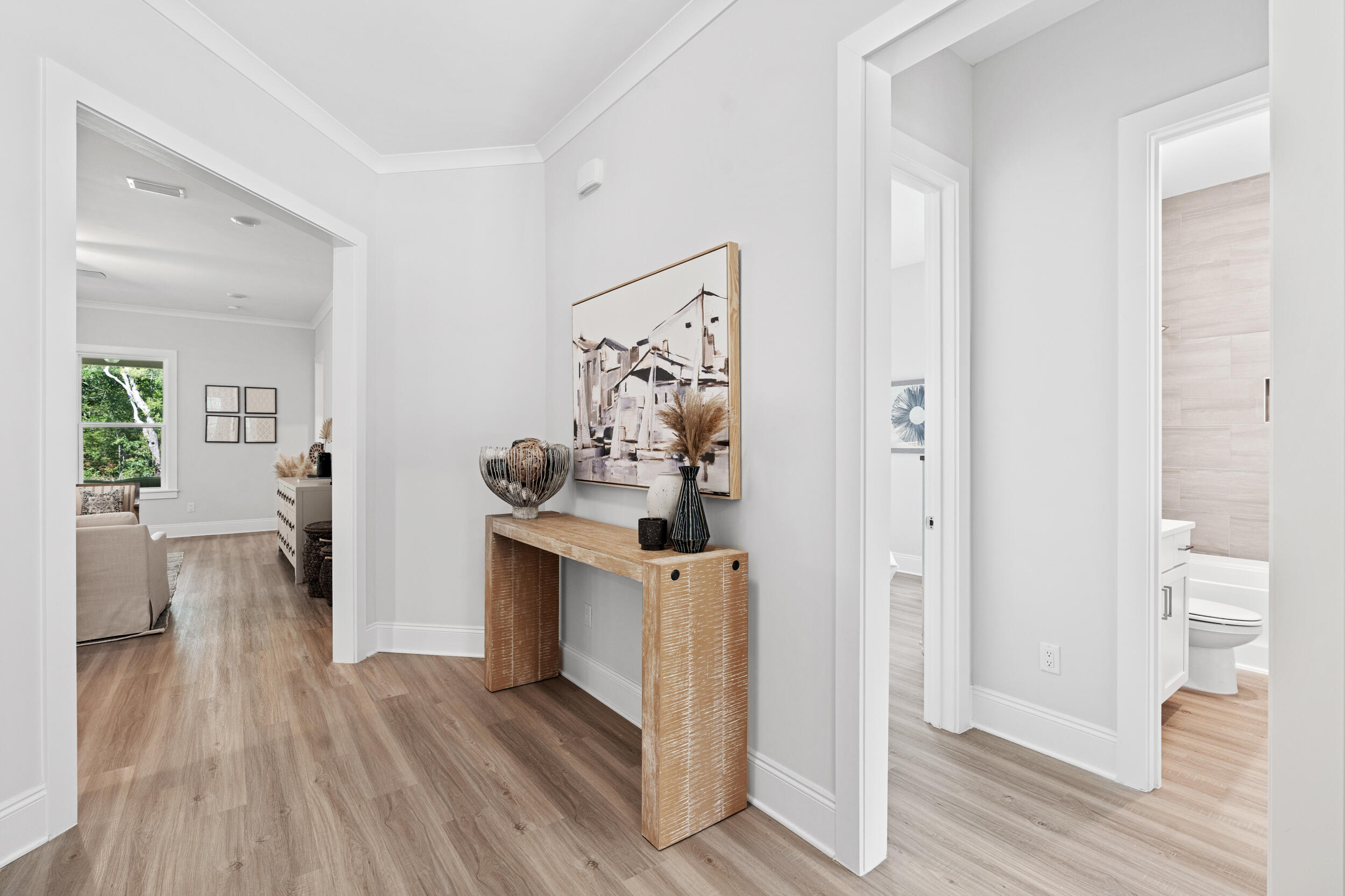 20 Mackenzie Lane, Unit LOT 34 Freeport, FL 32439 - Photo 7 of 50 wooden floor with white cabinets and wooden floor