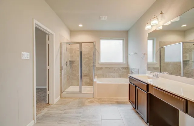 a bathroom with a bathtub and a sink