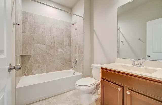 a bathroom with a sink a toilet and a bathtub