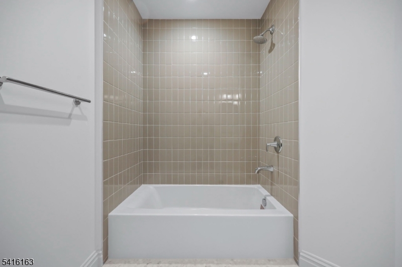 1209 Littleton Road, Unit B Morris Plains, NJ 07950 - Photo 16 of 19 a bathroom with a bathtub