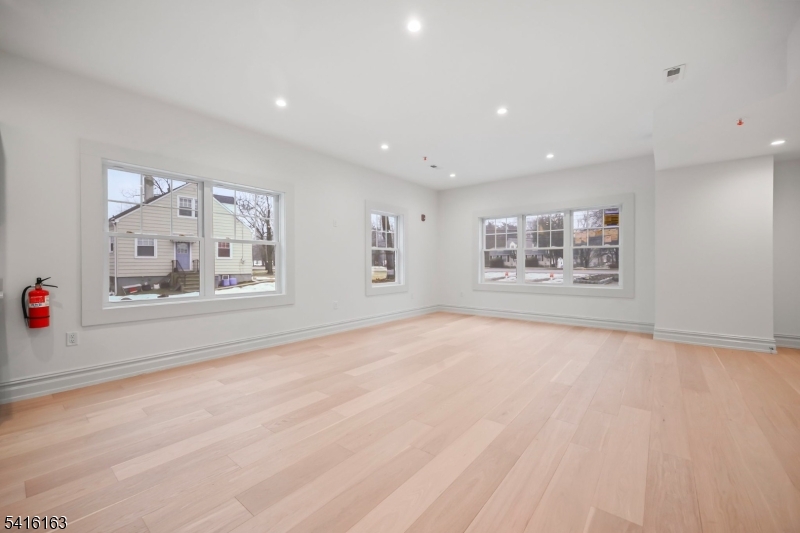 1209 Littleton Road, Unit B Morris Plains, NJ 07950 - Photo 2 of 19 a view of an empty room with a window