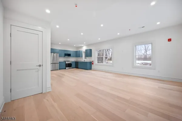 a view of kitchen and a window with furniture