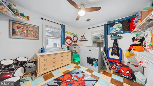 kids room with toys and a chandelier