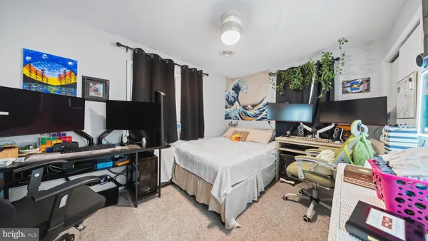 a room with furniture a rug and a flat screen tv