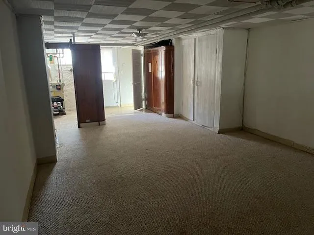 a view of a hallway with an entryway