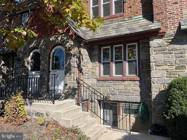 a front view of a house with glass windows