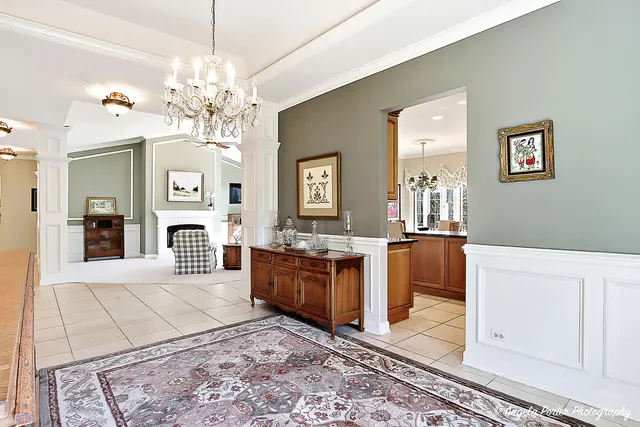 a large spacious bathroom with a granite countertop sink a mirror and a bathtub