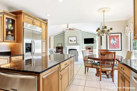 a kitchen with granite countertop center island and stainless steel appliances