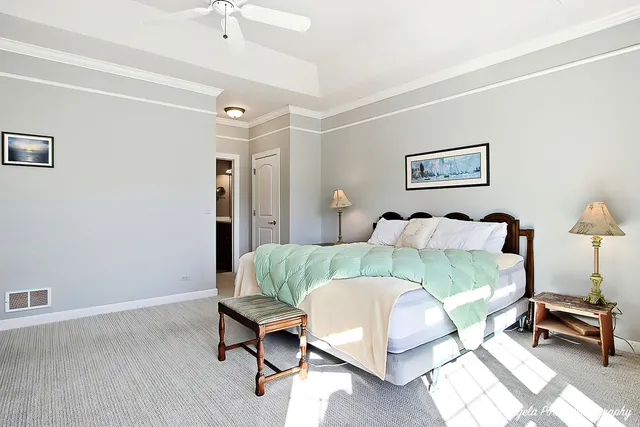 a bedroom with furniture and a window